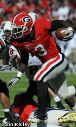Washaun Ealey rushes for yardage during Saturday's game. (Photo by John Kelley)
