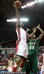 Travis Leslie goes up high to corral the ball.