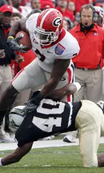 Georgia tight end Orson Charles (7) tries to get past Central Florida defensive back Reggie Weams (40) Friday. (AP Photo/Mark Humphrey)