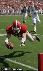 Georgia quarterback Aaron Murray (11) scores a touchdown during the Bulldogs' game with Arkansas on Saturday at Sanford Stadium. (Photo by Phillip Faulkner)