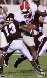Georgia tight end Orson Charles (7) is tackled by Mississippi State Johnthan Banks (13). (AP Photo/Kerry Smith)