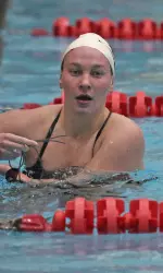 Melanie Margalis won two individual events and was on two victorious relays Saturday.