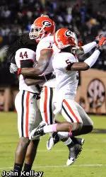 T.J. Stripling and Damian Swann celebrae with Bacarri Rambo
