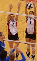 Kathleen Gates and Ann Dylla go up for a block vs. Kentucky.