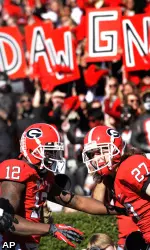 Rhett McGowan (27) celebrates his touchdown reception with wide receiver Tavarres King (12)