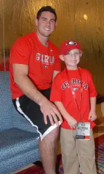 Georgia quarterback Aaron Murray greets Bulldog fan Cole Whitworth at the team hotel in Orlando on Wednesday. (Photo by Steven Colquitt)