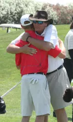 Coach Chris Haack hugs freshman Lee McCoy after the Bulldogs qualified for the NCAAs on Saturday.