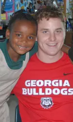 Former snapper Ty Frix visits with Atlanta area children Wednesday.