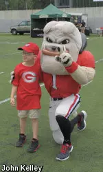 Hairy Dawg poses with Johnathan Compton