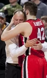 Georgia head coach Mark Fox, left, hugs Nemanja Djurisic after they defeated Missouri 70-64 in overtime Wednesday.