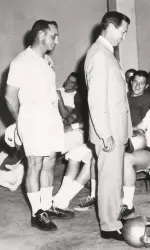 Carl Sanders (r) addresses Coach Dooley and the football team
