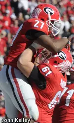 Offensive lineman David Andrews lifts Running back Nick Chubb after a touchdown