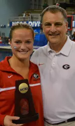 Laura Ryan and Coach Dan Laak are smiles after Ryan became the first Georgia diver to win a national title during the NCAA Championships on Thursday, March 20, 2014, in Minneapolis, Minn. (Photo by Steven Colquitt)