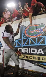 Todd Gurley celebrates with fans after winning over Florida on Saturday, Nov. 2, 2013 in Jacksonville.