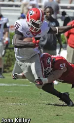 Linebacker Jake Ganus tackles running back A.J. Turman