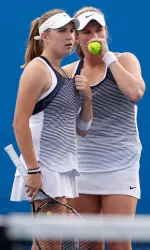Ellen Perez (left) and partner Belinda Woolcock confer during their match at the Australian Open. (Contributed photo)