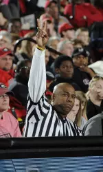 Derrick Floyd at the scorer's table during the Lady Bulldogs' game against the LSU earlier this season. (Photo by John Kelley)