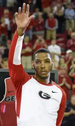 Senior Charles Mann waves to the crowd before the start of Saturday's game at Stegeman Coliseum. (Photo by David Barnes)