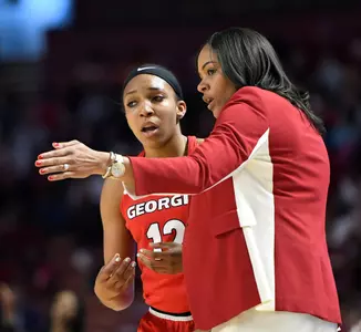 Head Coach Joni Taylor talks with guard Haley Clark (12)