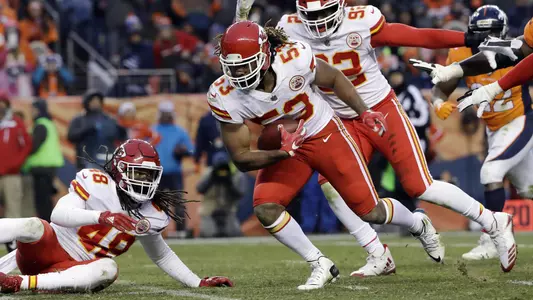 Kansas City Chiefs inside linebacker Ramik Wilson, center, picks up a fumble by Denver Broncos quarterback Paxton Lynch before returning it for a touchdown during the second half of an NFL football game Sunday, Dec. 31, 2017, in Denver. (AP Photo/Joe Mahoney )