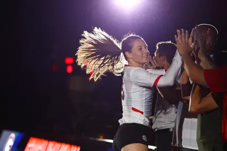 Georgia defensive specialist Sydney Gilliam (15) high-fives her coaches before the start of a volleyball match between The University of Georgia and Louisiana State University in Stegeman Coliseum in Athens, Ga., on Friday, Sept., 21, 2018. (Photo by Kristin M. Bradshaw)