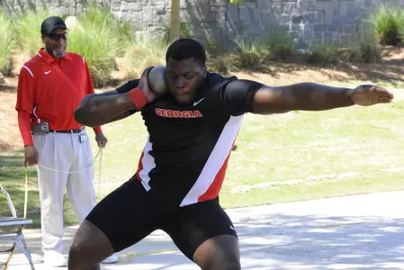 Georgia’s Denzel Comenentia throws the shot during the Spec Towns Invitational track meet at the Spec Towns Track Facility on Saturday, April 8, 2017 in Athens, Ga.(Photo by John Kelley/UGA)