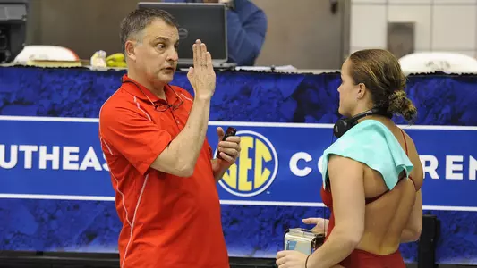 UGA diving coach Dan Laak with Laura Ryan during day one of the SEC Swimming and Diving Championships prelims held at the Gabrielsen Natatorium on Tuesday, Feb. 18, 2014 in Athens, Ga. ( photo by John Kelley )