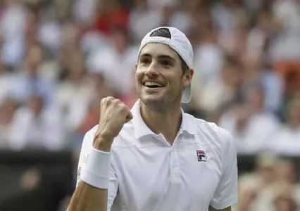 John Isner of the United States celebrates breaking serve during his men's singles semifinals match against South Africa's Kevin Anderson at the Wimbledon Tennis Championships, in London, Friday July 13, 2018.(AP Photo/Kirsty Wigglesworth)