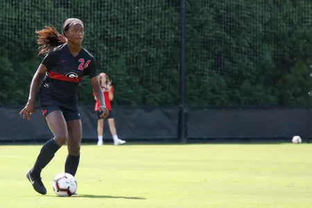 Georgia defense Cecily Stoute (24) dribbles the soccer ball during a scrimmage at the Turner Soccer Complex in Athens, Ga., on Saturday, Aug., 11, 2018. (Photo by Kristin M. Bradshaw)