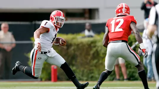 Justin Fields tries to run past Tray Bishop