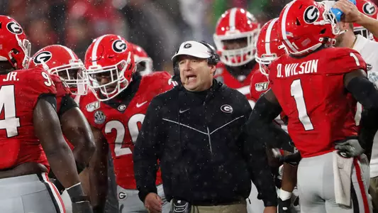 Georgia coach Kirby Smart talks to his players during a timeout in the first half of the team's NCAA college football game against Kentucky on Saturday, Oct. 19, 2019, in Athens, Ga. (AP Photo/John Bazemore)