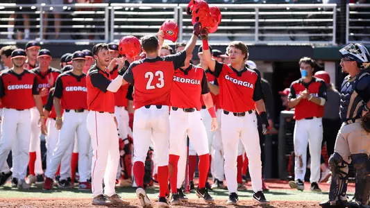 Teammates celebrate a grand slam hit by Georgia outfielder Connor Tate during an exhibition game against Columbus State at Foley Field in Athens, Ga., on Sunday, Oct. 20, 2019. (Photo by Tony Walsh)