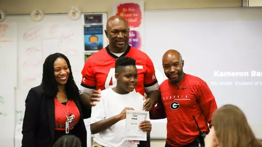 Former Georgia linebacker Randall Godfrey visited Alps Road Elementary in Athens, Ga., on Thursday, Oct. 31, 2019 to present students with student of the month awards. (Photo by Tony Walsh)