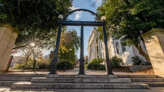 The Arch with the North Campus sidewalk and the Holmes-Hunter Academic building in the background.