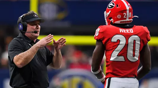 Georgia head coach Kirby Smart speaks to Georgia defensive back J.R. Reed (20) during the first half of the Southeastern Conference championship NCAA college football game against LSU, Saturday, Dec. 7, 2019, in Atlanta. (AP Photo/John Amis)