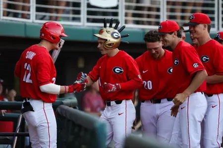 Georgia outfielder Tucker Maxwell (1) is welcomed back to the dugout after hitting a homerun during an NCAA regional baseball game between Georgia and Mercer in Athens, Ga., on Friday, May 31, 2019. (Photo by Kristin M. Bradshaw)