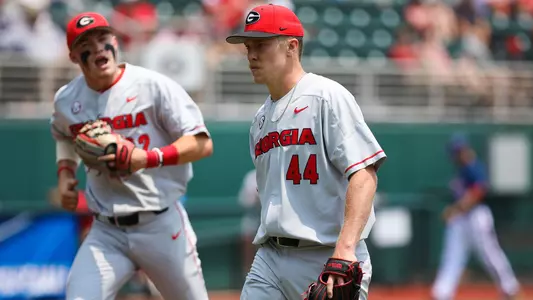 Georgia infielder Aaron Schunk (22) celebrates his teammate Georgia pitcher Tim Elliott (44) during an NCAA regional baseball game between Georgia and Florida Atlantic in Athens, Ga., on Sunday, June 2, 2019. (Photo by Kristin M. Bradshaw)