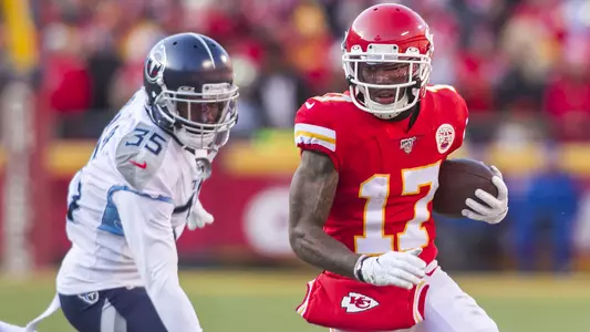 Kansas City receiver Mecole Hardman (17) runs around Tennessee defensive back Tramaine Brock (35) for extra yardage during the AFC Championship Game on Sunday.