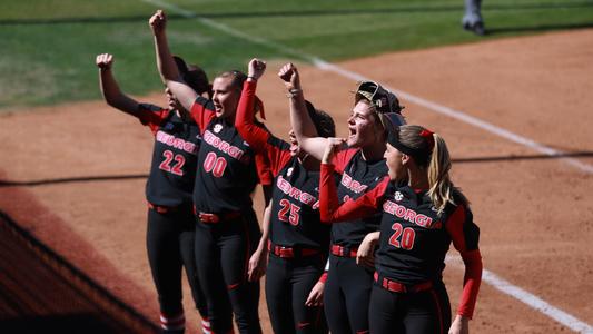 The team leads fans in a cheer during a softball game between the University of Georgia and the Louisiana State University in Jack Turner Softball Stadium in Athens, Ga., on Saturday, March 23, 2019. (Photo by Lauren Tolbert)