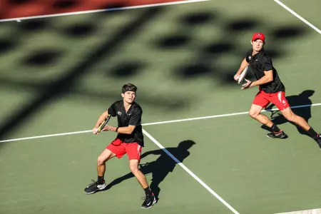 Georgia tennis player Britton Johnston, Georgia tennis player Billy Rowe during a match against Georgia Southern at the Dan Magill Tennis Complex in Athens, Ga., on Feb. 17, 2021. (Photo by Chamberlain Smith)