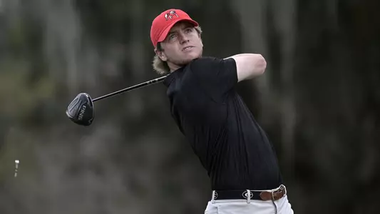 Connor Creasy, of Georgia, watches his tee shot on the 16th hole during an NCAA golf tournament on Friday, Feb. 12, 2021, in Gainesville, Fla. (AP Photo/Phelan M. Ebenhack)