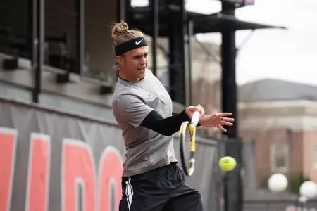 Philip Henning hits a forehand during Georgia's win over UCF on Sunday at the Dan Magill Tennis Complex.