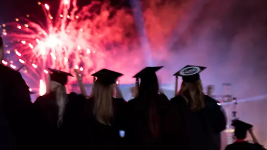 Undergraduate students watch the fireworks at the end of the 2018 Spring Undergraduate Commencement Ceremony.