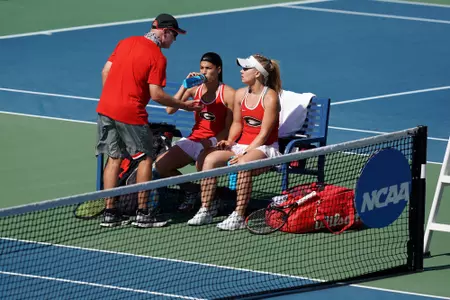 Coach Jeff Wallace with Elena Christofi and Morgan Coppoc