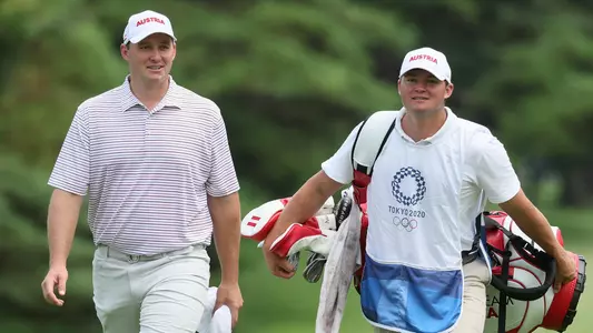 KAWAGOE, JAPAN - JULY 30: Sepp Straka of Team Austria and caddie Samuel Straka walk to the fifth tee during the second round of the Men's Individual Stroke Play on day seven of the Tokyo 2020 Olympic Games at Kasumigaseki Country Club on July 30, 2021 in Kawagoe, Saitama, Japan. (Photo by Mike Ehrmann/Getty Images)