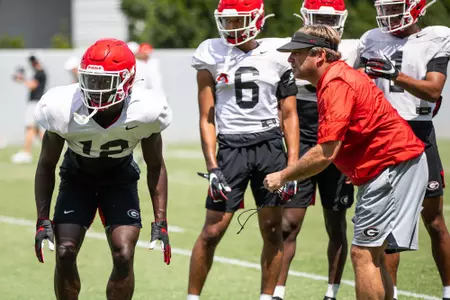 Georgia defensive back Lovasea Carroll (12), Georgia head coach Kirby Smart during the Bulldogs’ practice session in Athens, Ga., on Monday, Aug. 9, 2021. (Photo by Tony Walsh)