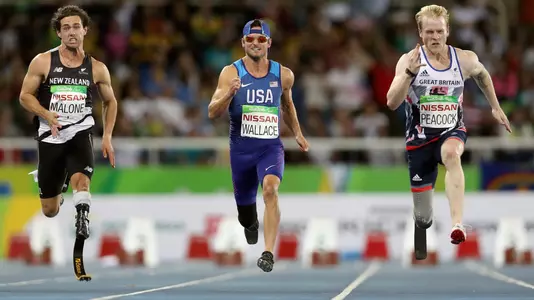 RIO DE JANEIRO, BRAZIL - SEPTEMBER 09: Liam Malone of New Zealand, Jarryd Wallace of the United States and Jonnie Peacock of Great Britain compete in the men's 100 meter T44 final on day 2 of the Rio 2016 Paralympic Games at on September 9, 2016 in Rio de Janeiro, Brazil. (Photo by Matthew Stockman/Getty Images)