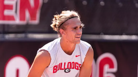 Senior Philip Henning preparing to return a serve during practice.