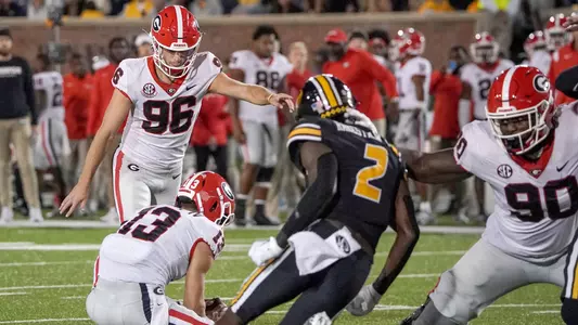Oct 1, 2022; Columbia, Missouri, USA; Georgia Bulldogs place kicker Jack Podlesny (96) kicks a point after touchdown against the Missouri Tigers during the first half at Faurot Field at Memorial Stadium. Mandatory Credit: Denny Medley-USA TODAY Sports