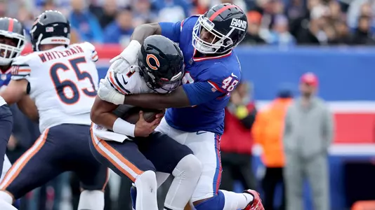 Oct 2, 2022; East Rutherford, New Jersey, USA; Chicago Bears quarterback Justin Fields (1) is tackled by New York Giants linebacker Tae Crowder (48) during the second quarter at MetLife Stadium. Mandatory Credit: Brad Penner-USA TODAY Sports